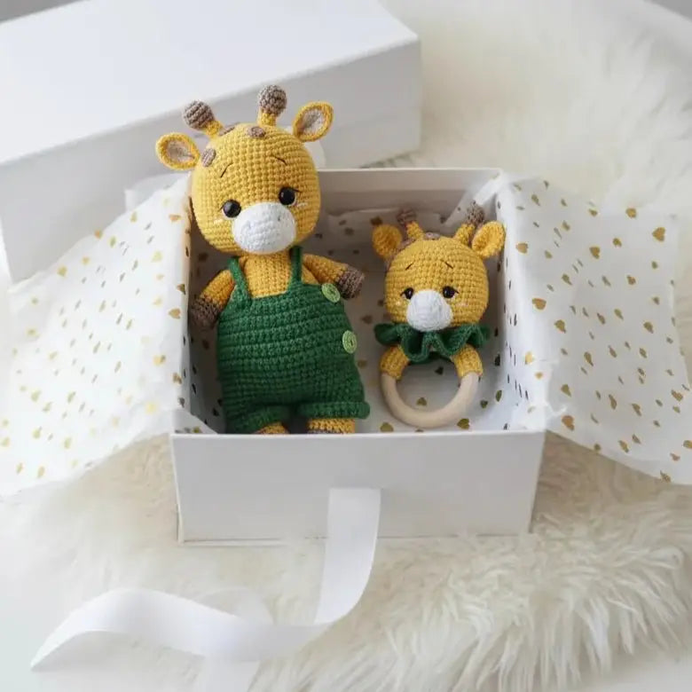Crocheted yellow and green giraffe stuffed toy and baby teething ring in gift box