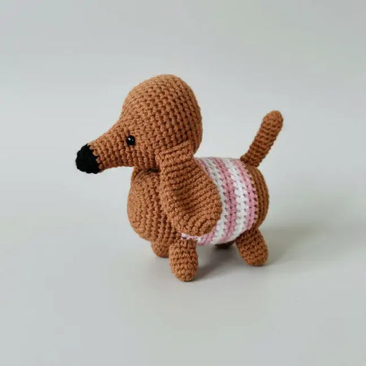 Crocheted dachshund with pink striped sweater, handmade amigurumi toy
