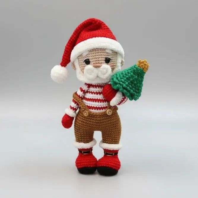 Crocheted Santa Claus figurine with Christmas tree, wearing striped shirt and red hat