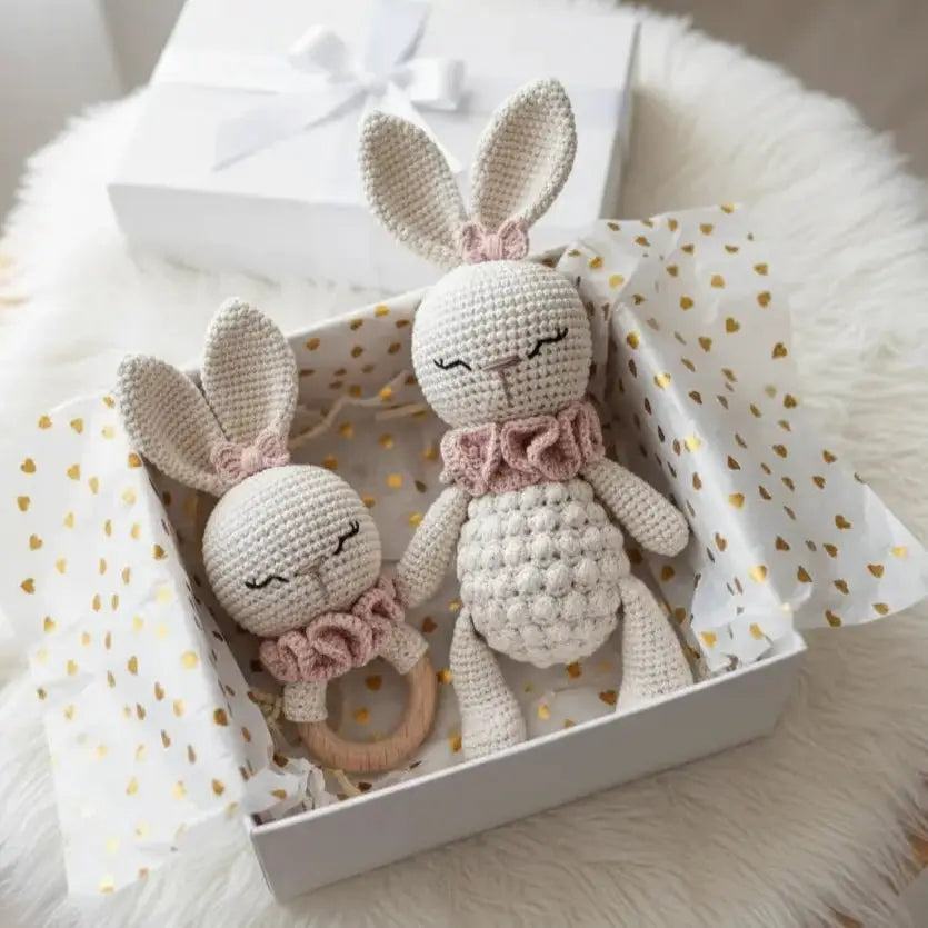 Crocheted bunny dolls with ruffled collars in a white gift box with gold hearts