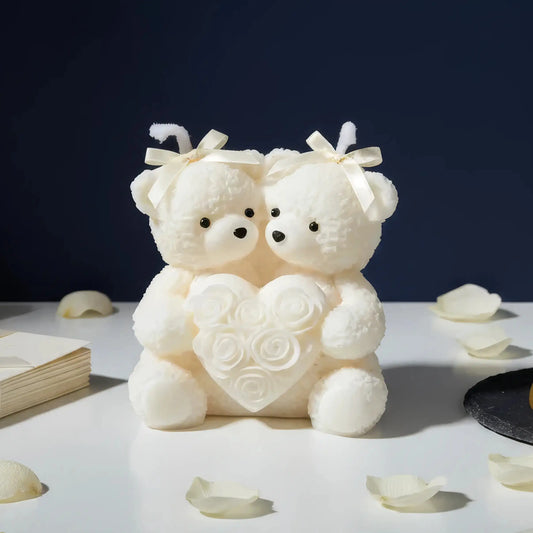 Two white teddy bears holding a heart with rose petals on a dark background