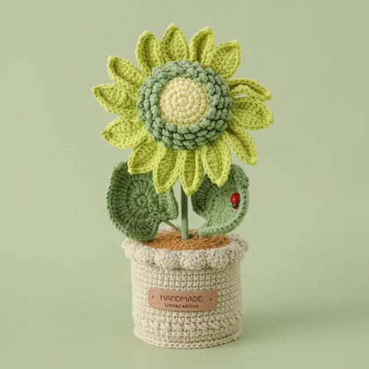 Crocheted sunflower with green petals in a handmade limited edition pot