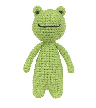 Green crocheted frog plush toy with a simple smile, standing upright against a white background