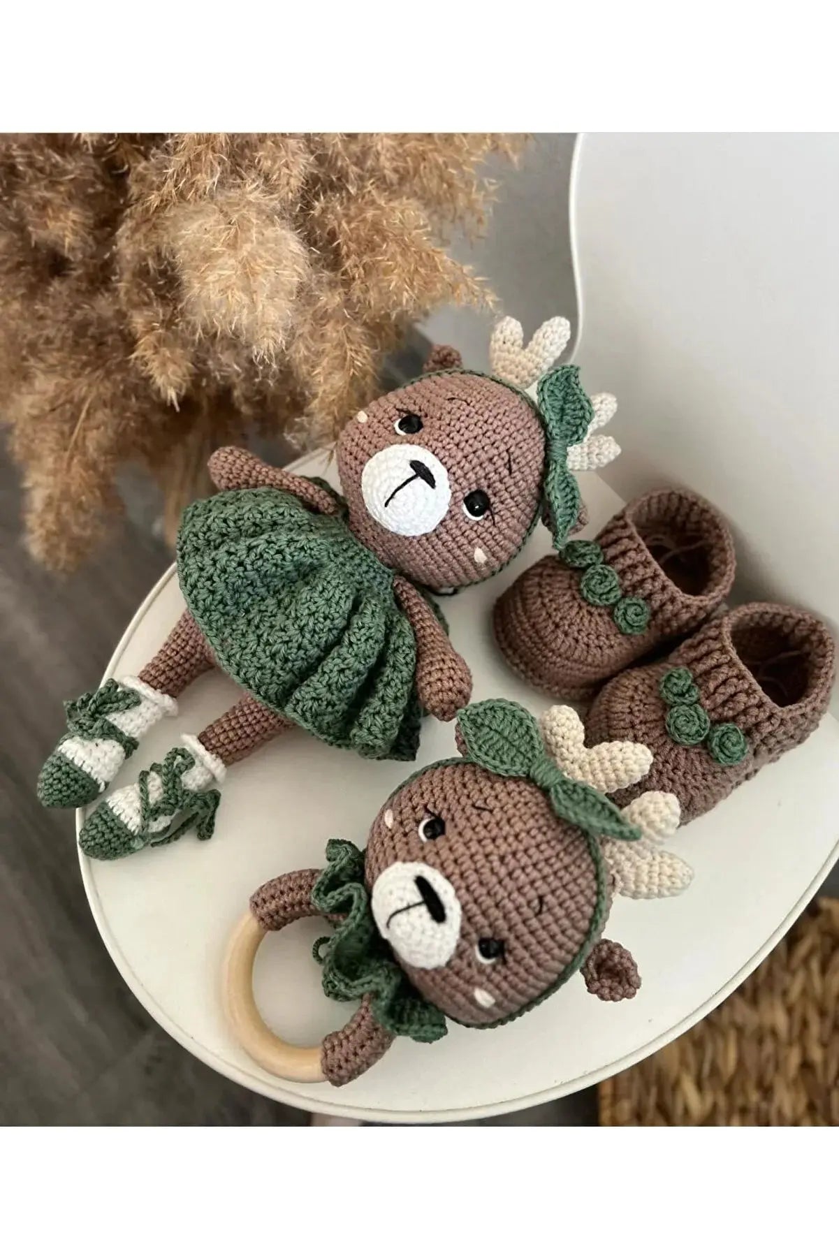 a group of stuffed animals sitting on top of a white table