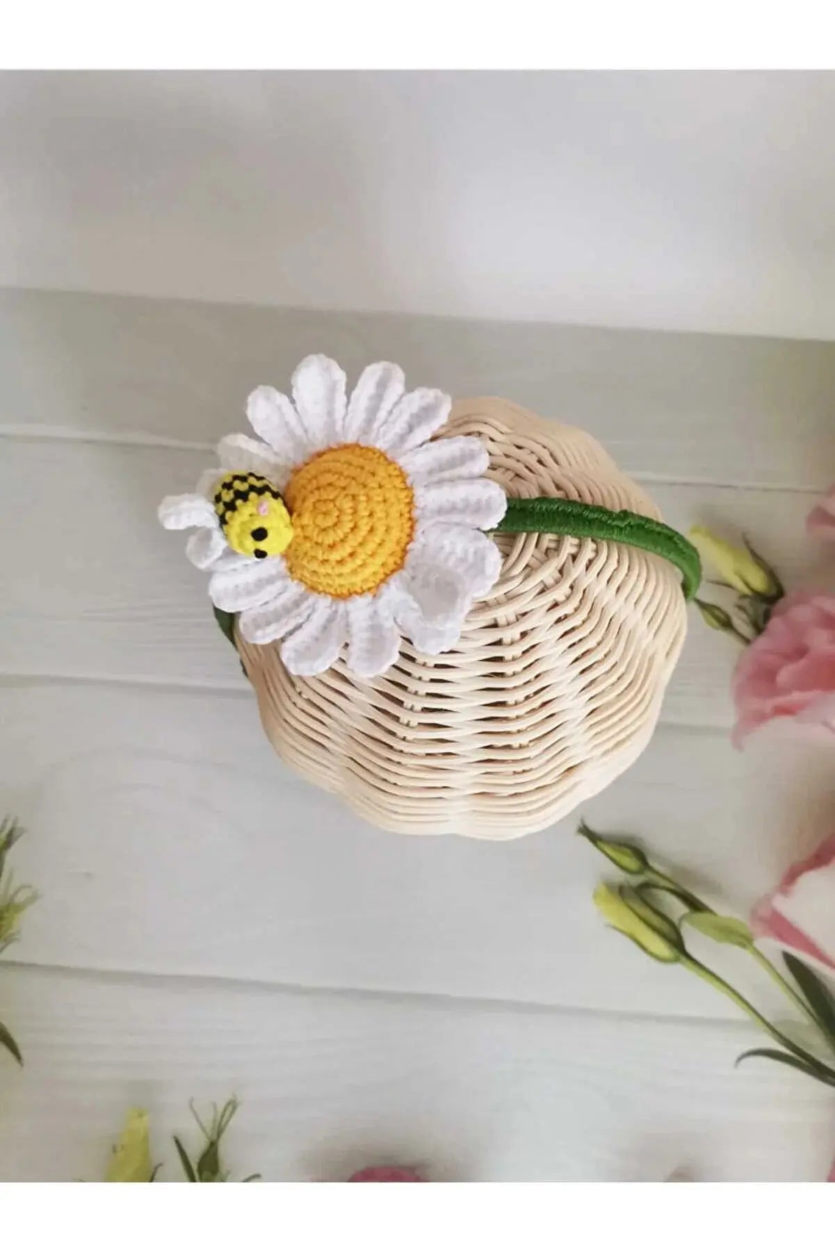 a basket with a flower on top of it