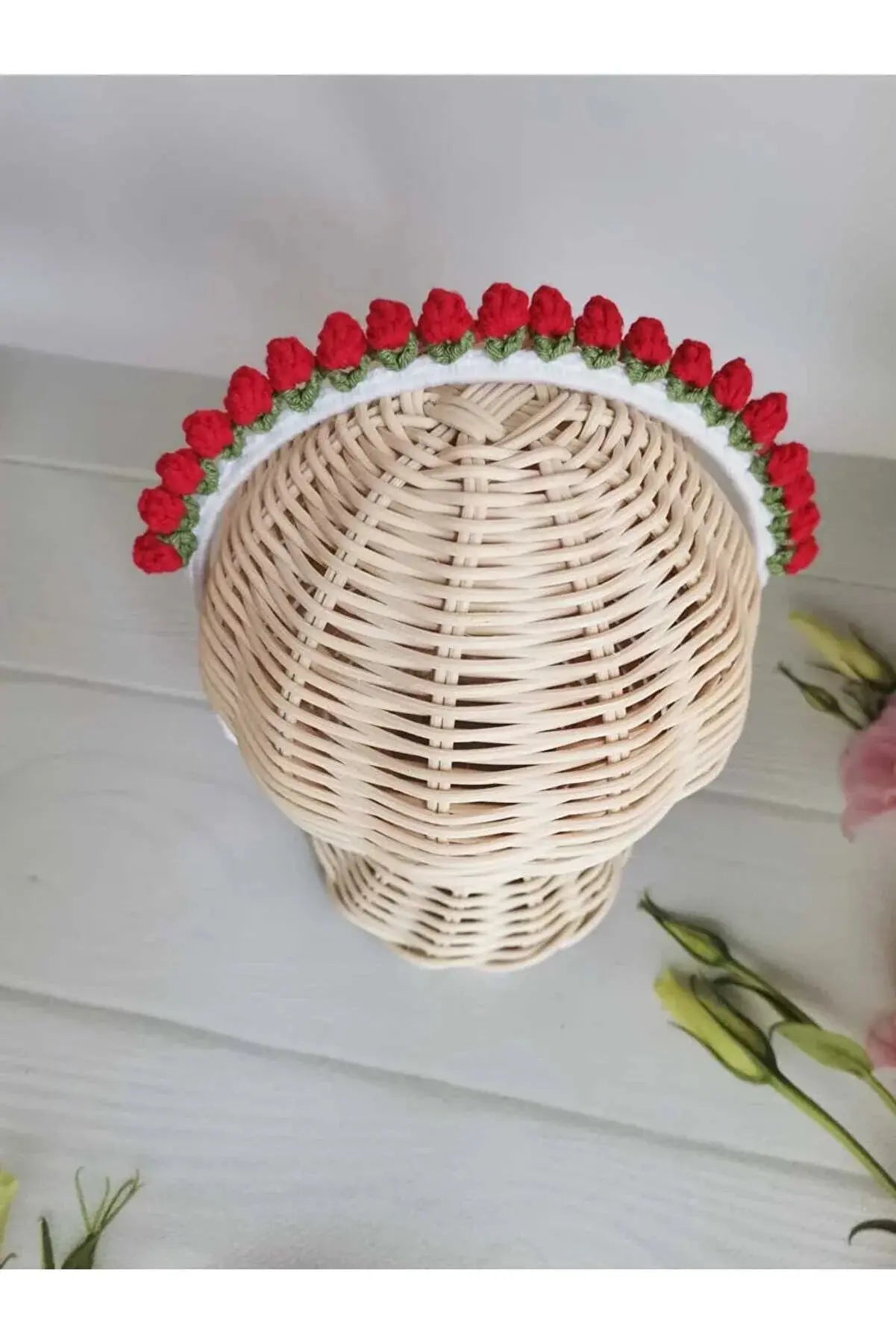 a wicker basket with red roses on it