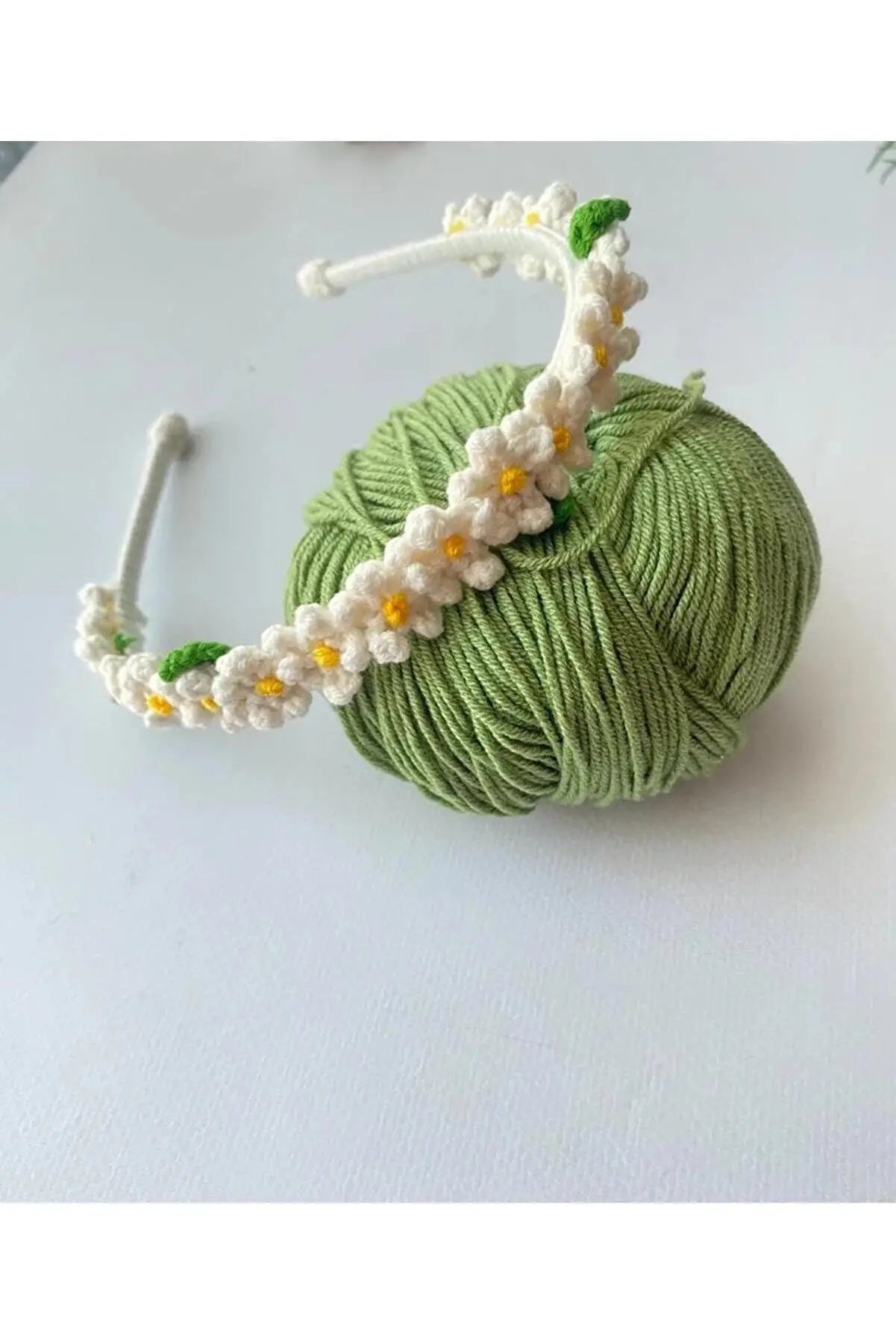 a ball of yarn with flowers on it