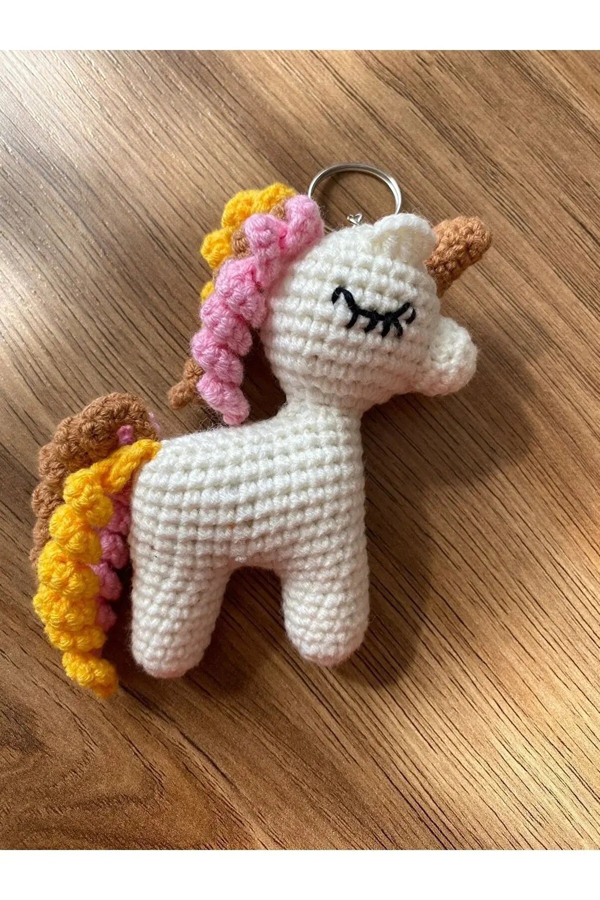 a crocheted keychain with a unicorn on it