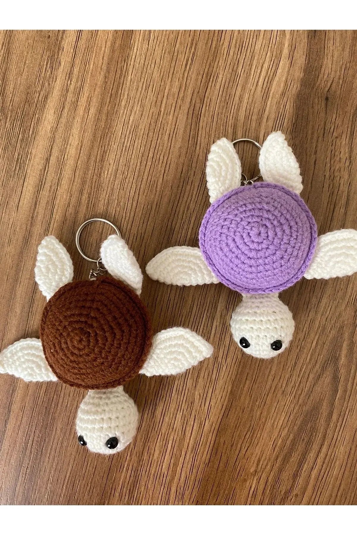 a crocheted turtle keychain and a crocheted turtle keychai