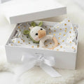 Crocheted bunny rattle with wooden ring in white gift box with gold heart tissue paper