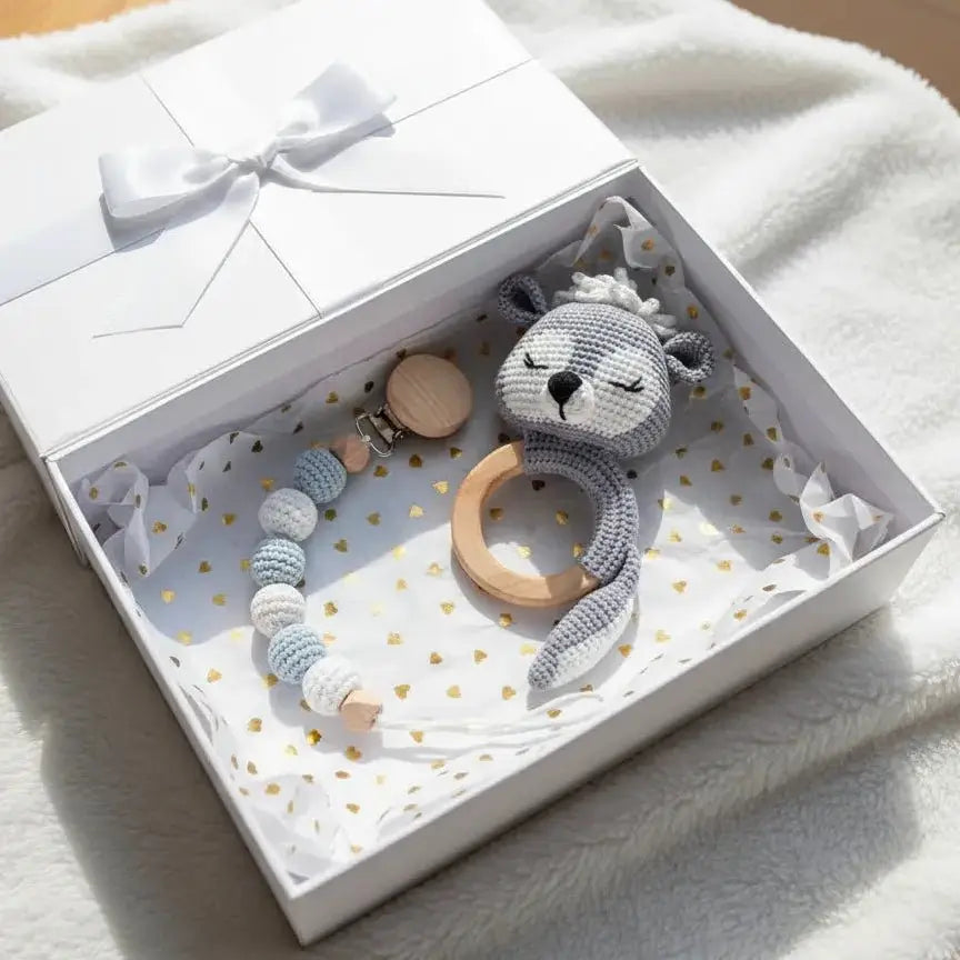 Crocheted gray animal teething toy and beaded pacifier clip in white gift box