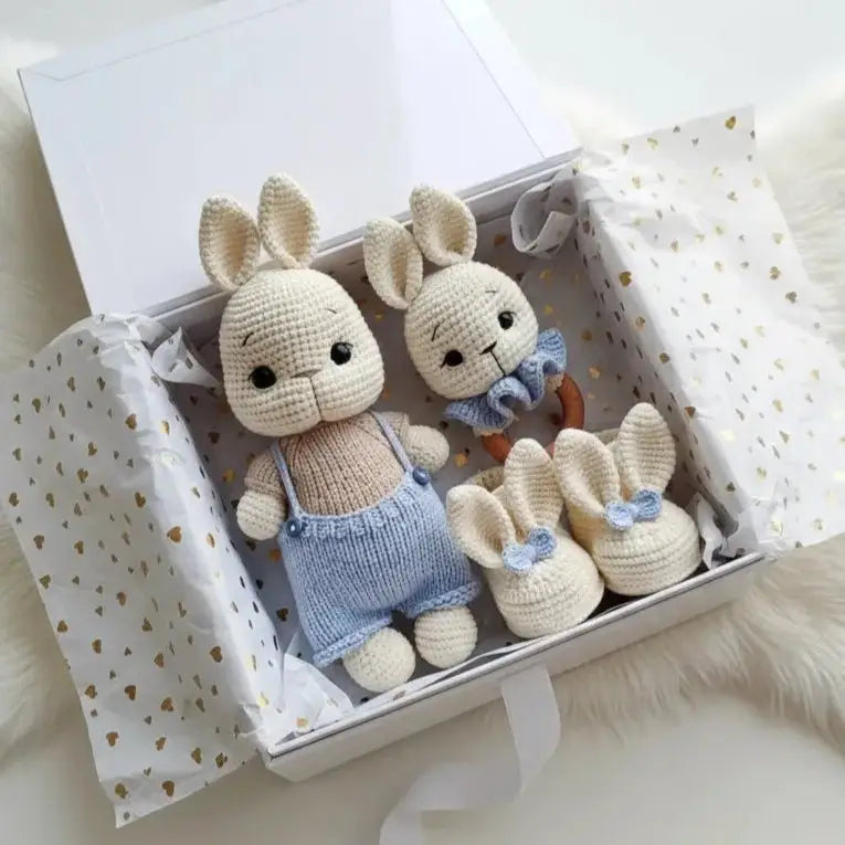 Handmade crocheted bunny dolls in blue overalls with matching baby booties in gift box