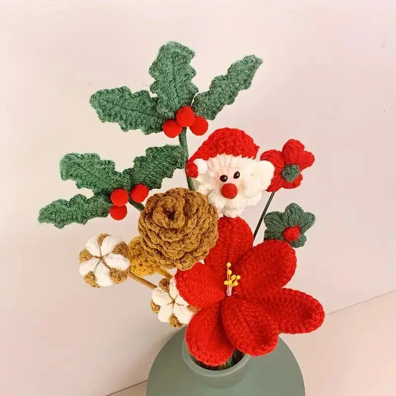 Crocheted Christmas bouquet with Santa, holly, poinsettia, and pinecone in green vase