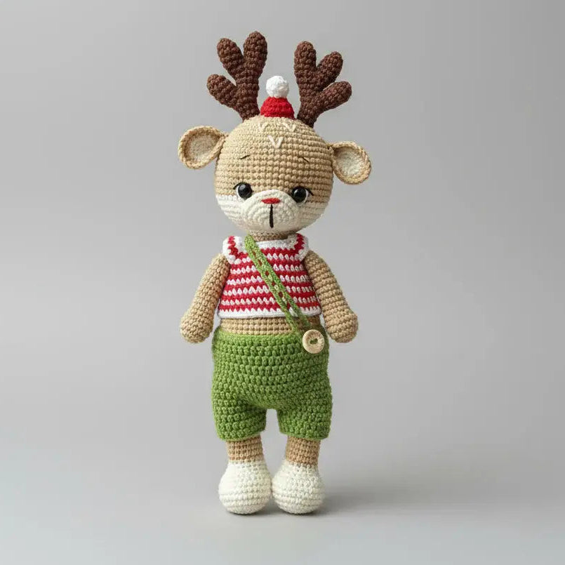 Crocheted reindeer toy with red and green outfit and antler hat