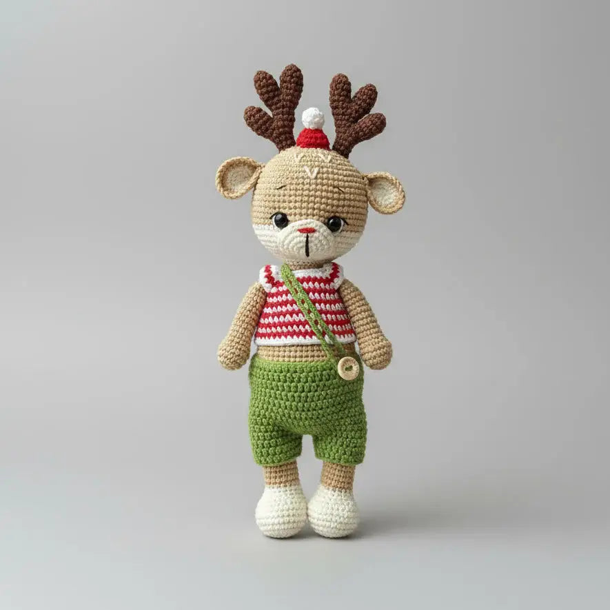 Crocheted reindeer toy with red and green outfit and antler hat