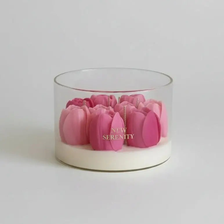 Glass container with pink flowers labeled 'New Serenity' on a beige background
