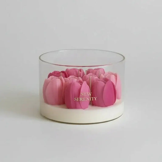 Glass container with pink flowers labeled 'New Serenity' on a beige background