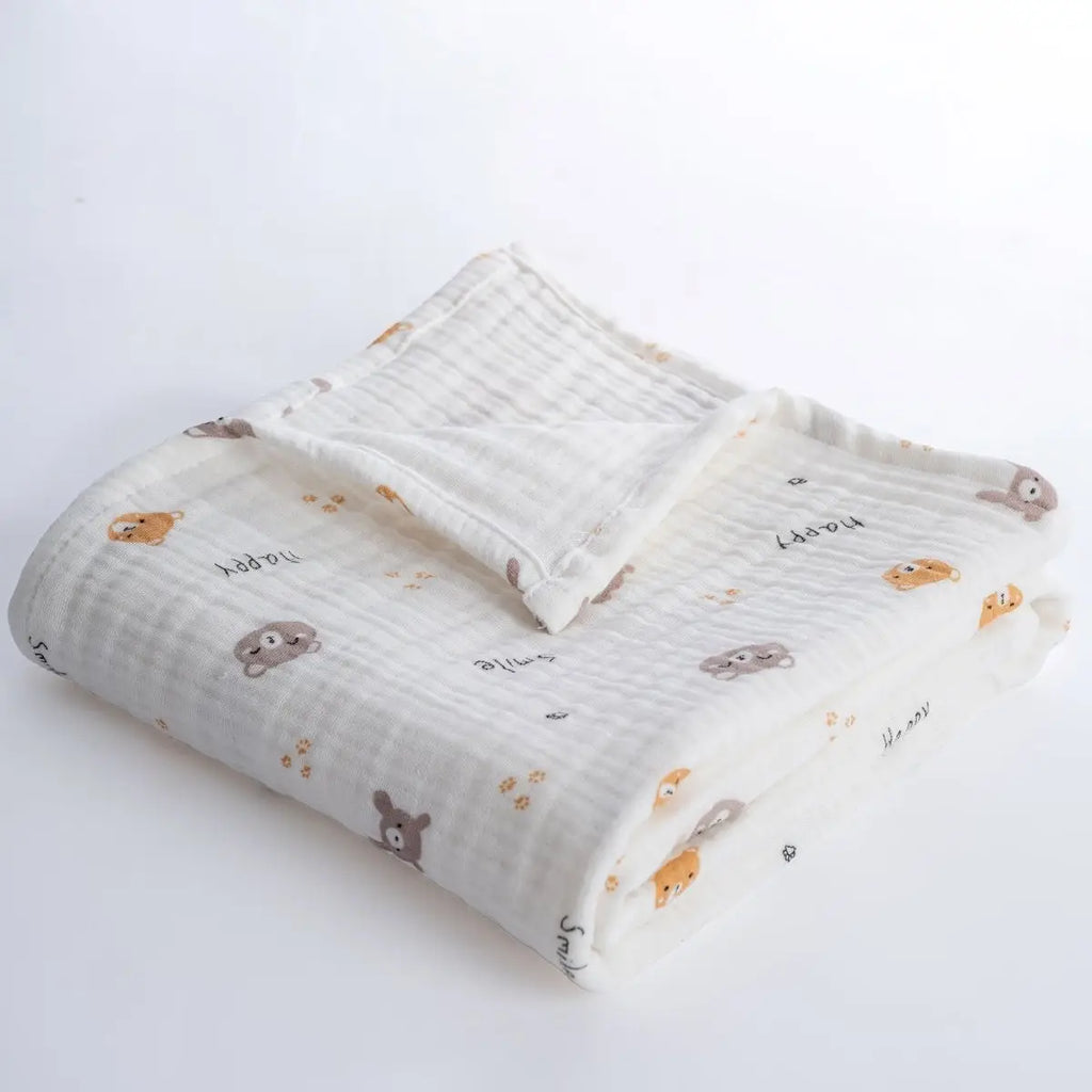 Folded baby blanket with animal pattern on a white background