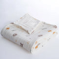Folded baby blanket with animal pattern on a white background