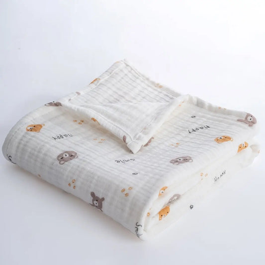 Folded baby blanket with animal pattern on a white background