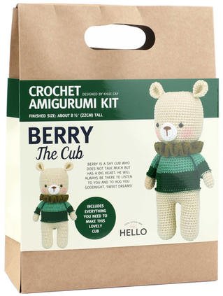 Crochet amigurumi kit packaging with two cute bears in green sweaters