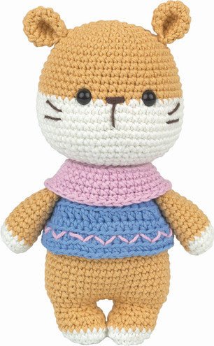 Crocheted hamster plush with pink scarf and blue sweater with decorative stitching