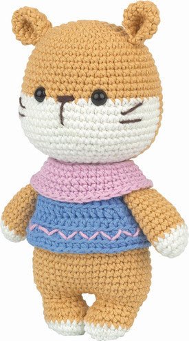 Crocheted stuffed hamster toy with pink scarf and blue sweater, standing upright