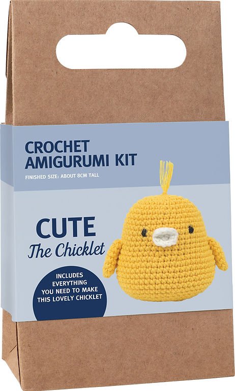 Yellow crocheted chick amigurumi craft kit in brown packaging with blue label