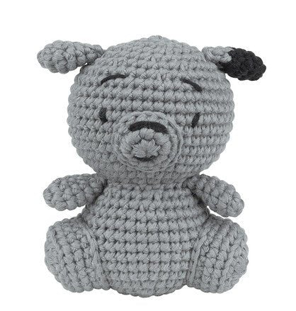 Gray crocheted stuffed puppy with closed eyes, sitting in a cute rounded pose.