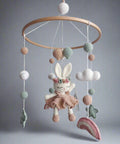 Crocheted baby mobile with bunny, clouds, balls, and stars in pastel colors
