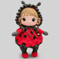 Crocheted ladybug doll with red dress, gray trim, and cute button eyes