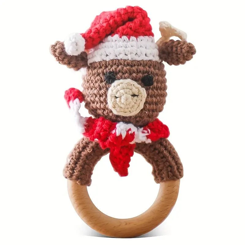 Crocheted reindeer rattle with red Santa hat on wooden teething ring