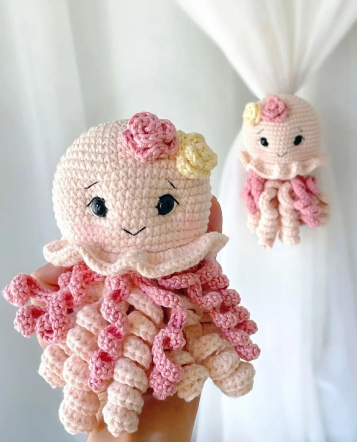 Handmade pink crocheted octopus toys with cute faces and curly tentacles