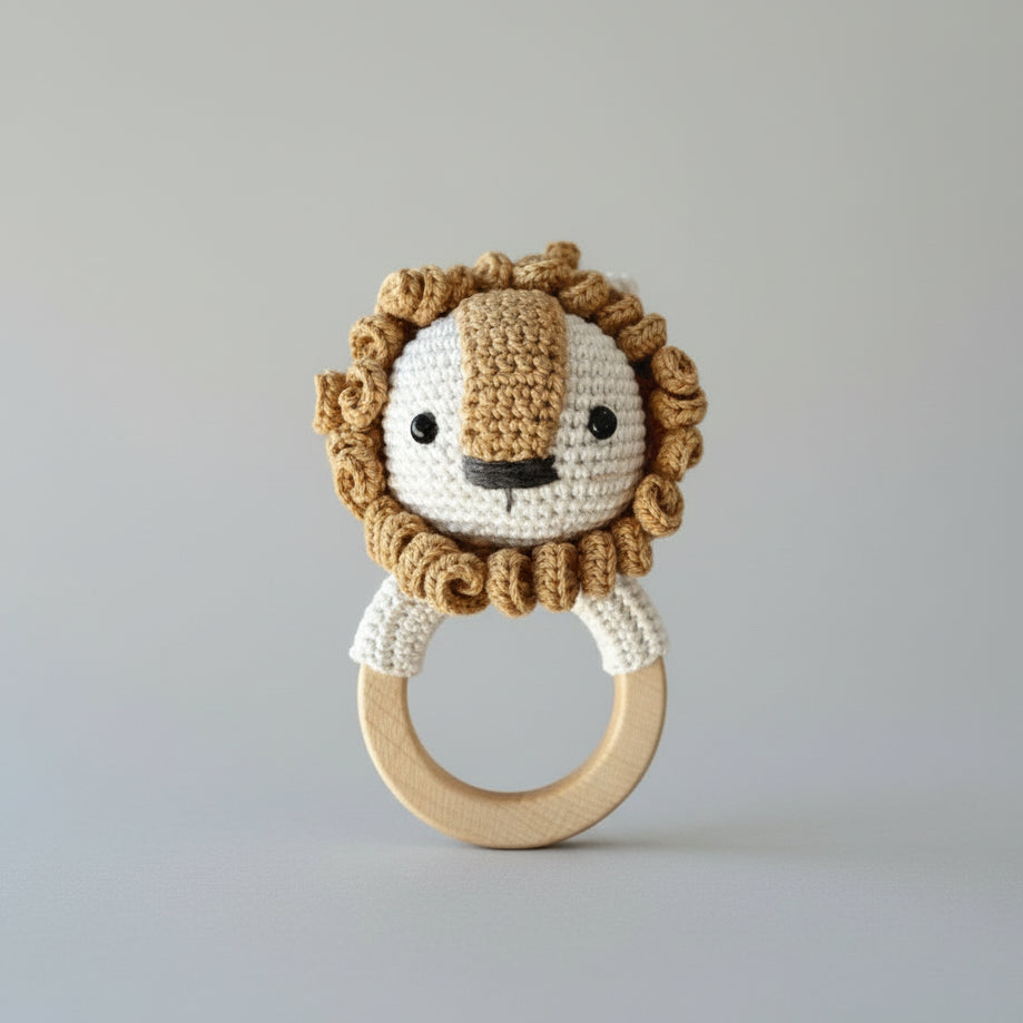 Crocheted lion baby teething ring with wooden circle and cute smiling face