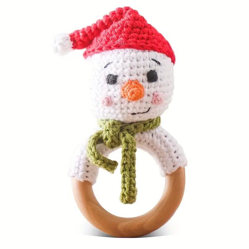Crocheted snowman rattle with red hat and green scarf on wooden ring
