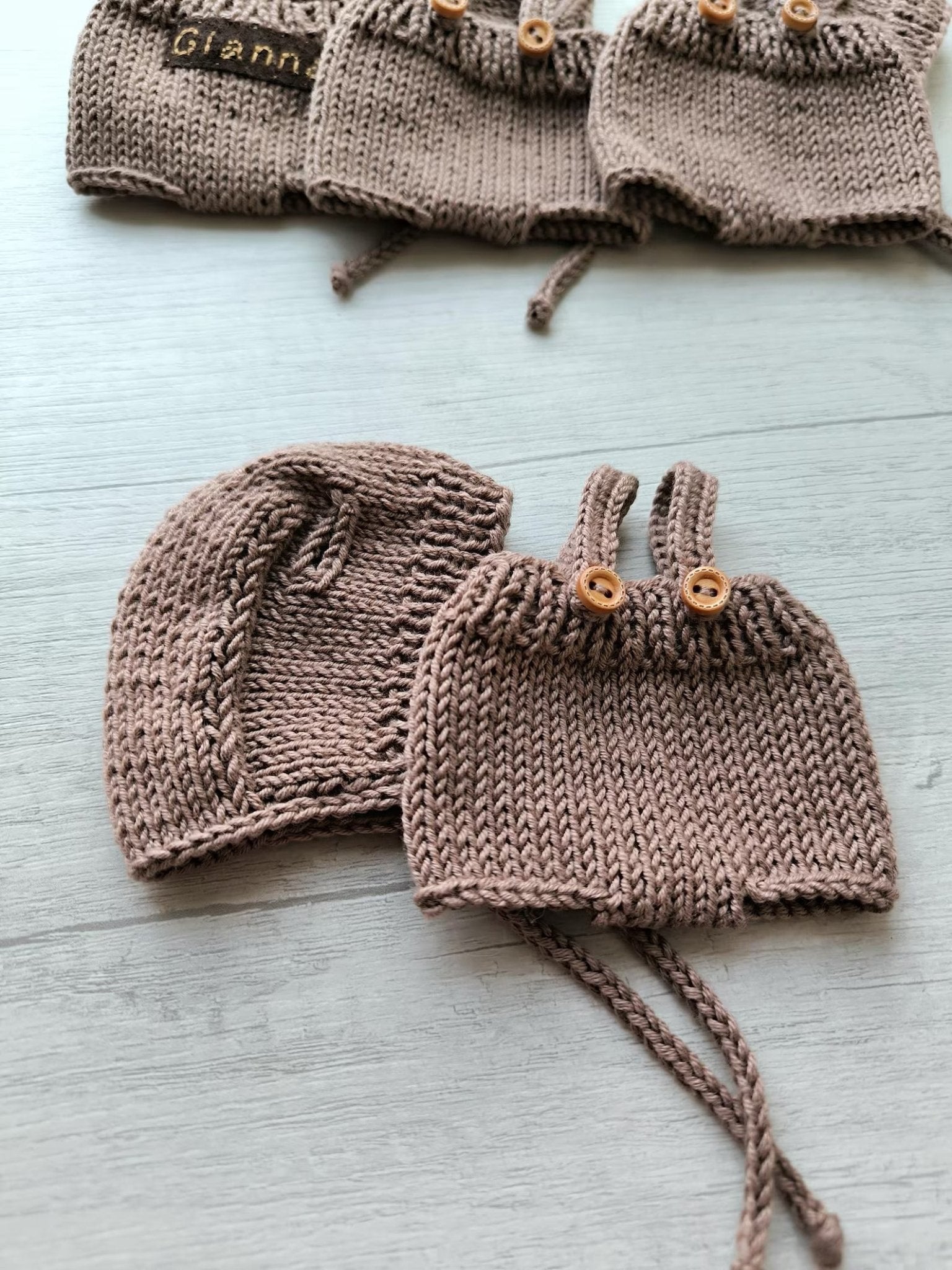 Handknit taupe baby sweater and hat set with wooden buttons and drawstrings