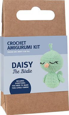 Cardboard packaging for green crocheted Daisy the Birdie amigurumi craft kit