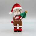 Crocheted Santa Claus figurine with Christmas tree, wearing striped shirt and red hat