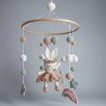 Crocheted baby mobile with bunny, clouds, balls, and stars in pastel colors