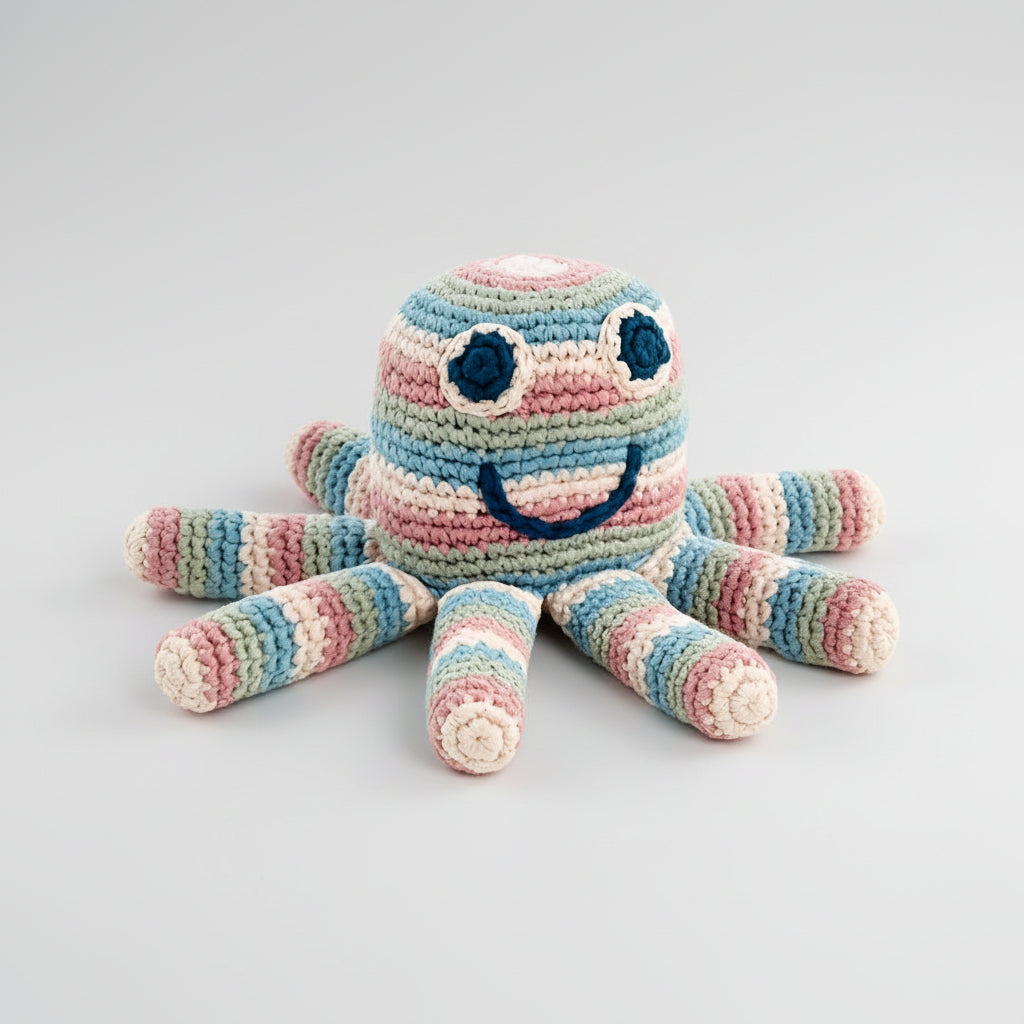 Crocheted octopus toy in pastel blue, pink, and green stripes with cute face
