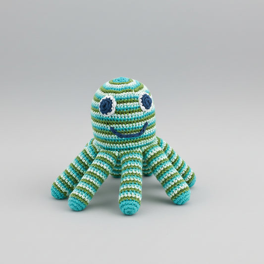 Crocheted octopus toy in blue and green striped yarn with cute button eyes