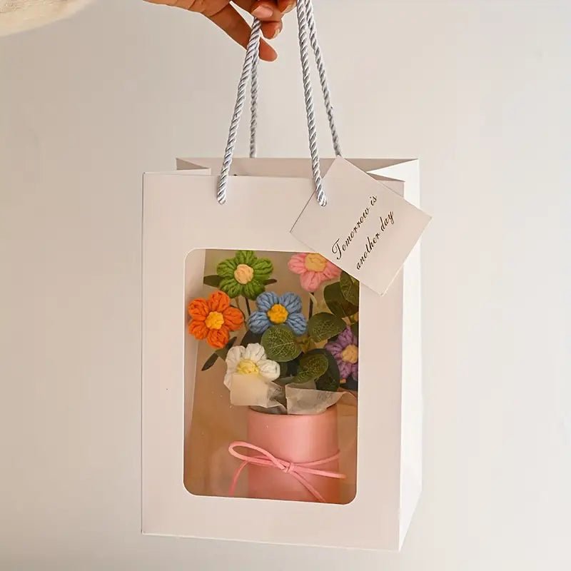 Colorful felt flowers in pink box with gift bag and tag, tied with pink ribbon