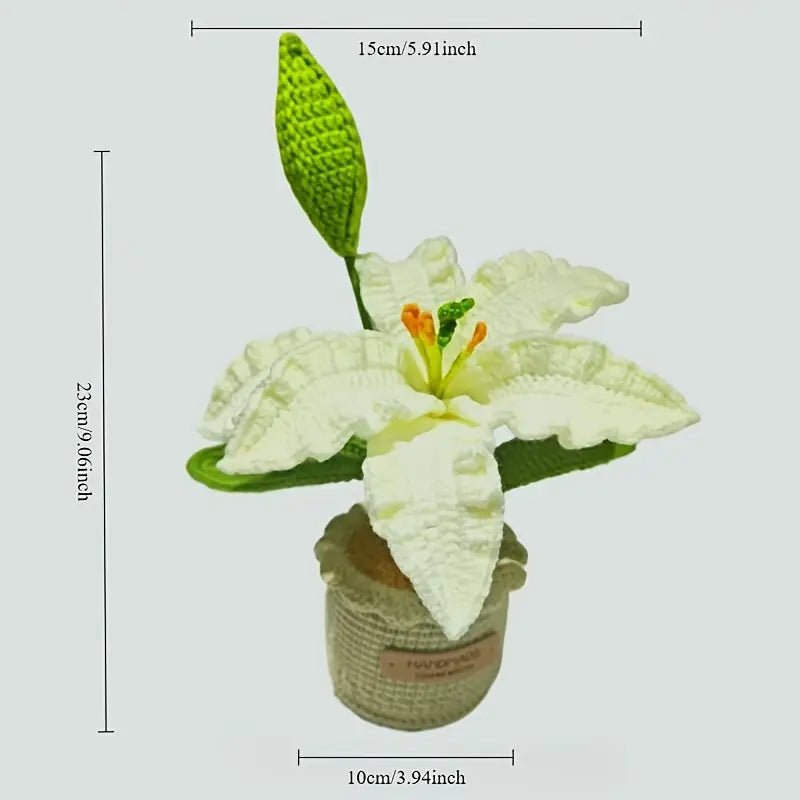 Crocheted white lily flower with green leaf in small burlap pot with measurement lines