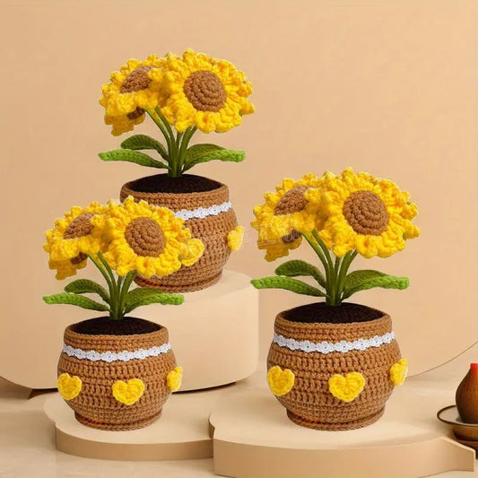 Crocheted sunflowers in brown pots with white lace and yellow heart details
