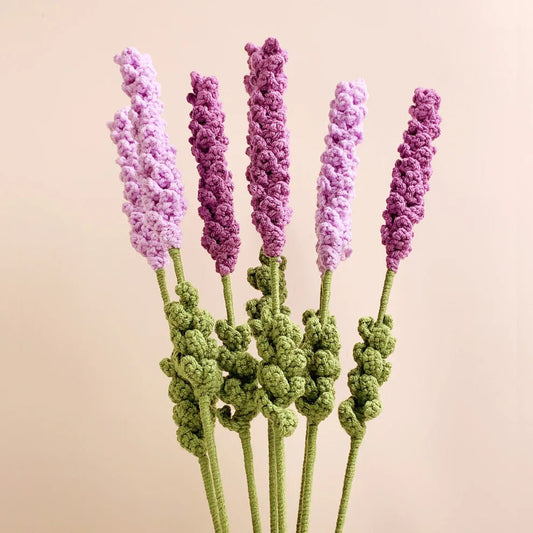 Five crocheted lavender stems in purple and green against a neutral background