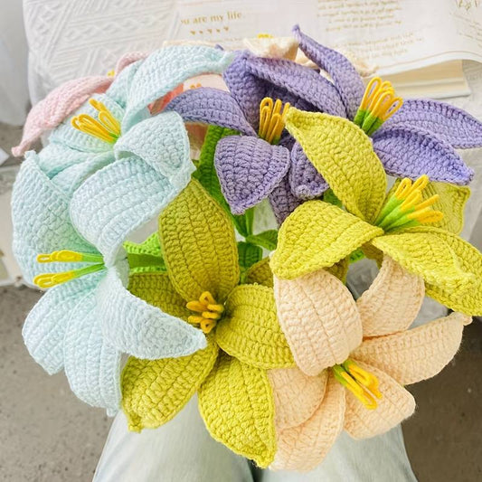 Crocheted bouquet of pastel flowers with yellow stamens in mint, yellow, purple, and peach
