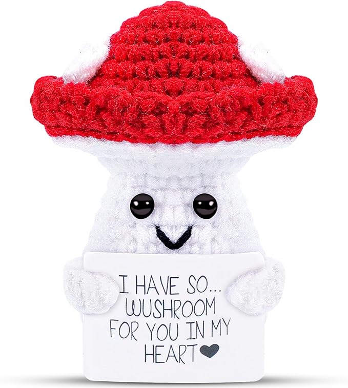 Cute knitted mushroom plush with red hat holding sign about having wushroom in heart