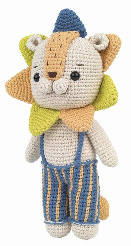 Crocheted stuffed animal cat in blue hat and striped overalls, soft pastel colors