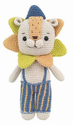 Crocheted stuffed animal cat wearing blue striped overalls and a blue knit hat