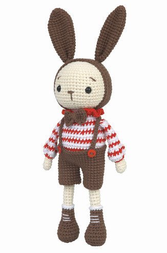 Crocheted bunny wearing striped sweater and brown overalls, standing upright